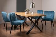 The Bentley Designs Ramsay Rustic Oak Effect Melamine 6 Seater Dining Table with X Leg & 4 Cezanne Petrol Blue Velvet Fabric Chairs with Sand Black Powder Coated Legs 