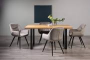 The Bentley Designs Ramsay Rustic Oak Effect Melamine 6 Seater Dining Table with U Leg & 4 Dali Grey Velvet Fabric Chairs with Sand Black Powder Coated Legs 