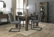 The Bentley Designs Turin Dark Oak 4-6 Seater Table & 4 Lewis Distressed Dark Grey Fabric Cantilever Chairs with Sand Black Powder Coated Frame