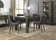 The Bentley Designs Turin Dark Oak 4-6 Seater Table & 4 Cezanne Dark Grey Faux Leather Chairs with Sand Black Legs