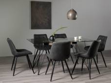 The Bentley Designs Miro Clear Tempered Glass 6 Seater Dining Table & 6 Seurat dark Grey Faux Suede Fabric Chairs with Sand Black Powder Coated Legs