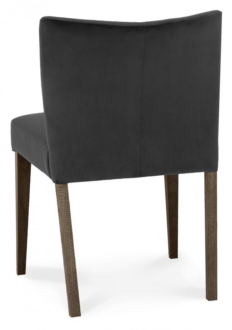 Back of the Bentley Designs Turin Dark Oak Low Back Uph Chair in Gun Metal Velvet