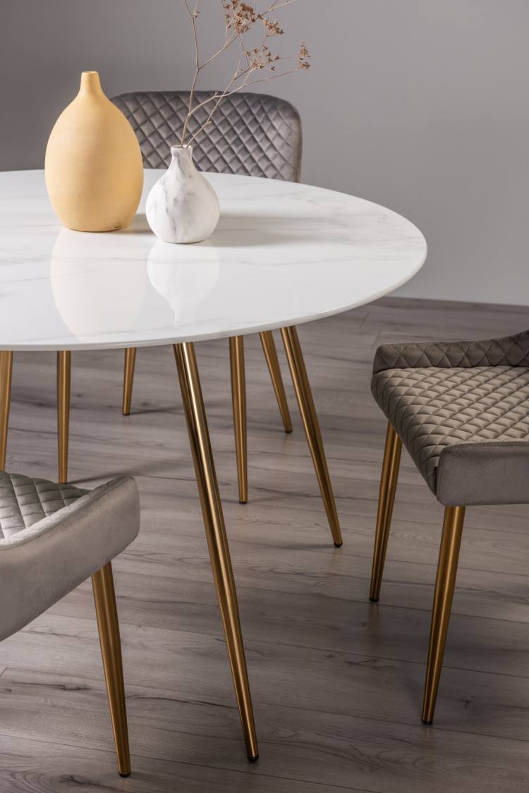Close up of the Bentley Designs Francesca White Marble Effect Tempered Glass 4 Seater Dining Table & 4 Cezanne Grey Velvet Fabric Chairs with Matt Gold Played Legs 