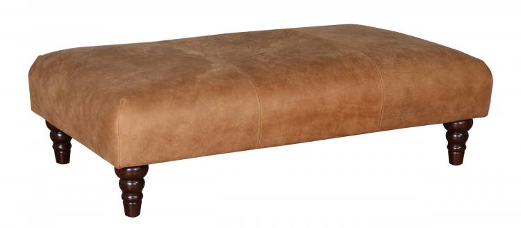 Beatrix footstool shown in Capri Tan leather with Antique dark turned legs 