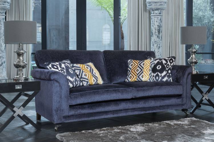 Grand sofa in fabric 2962, large scatter cushions in 2422, small scatter cushions in 2302, ebony/polished chrome castor legs (FM2).