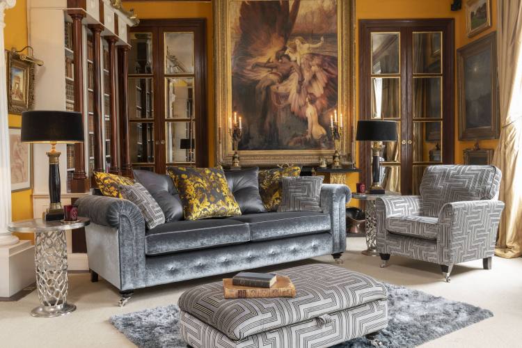 The Alstons Palazzo 4 Seater pillowback Sofa in Gunmetal Lustrous Velvet Plain with the Alstons Palazzo Accent Chair in Steel Eros Velvet