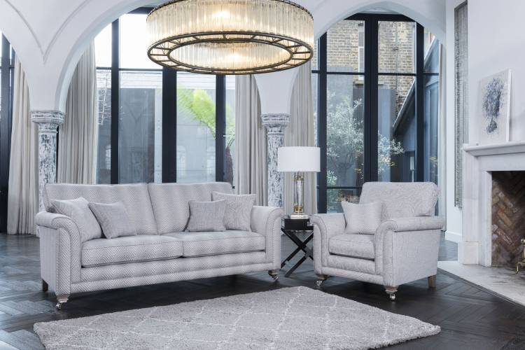 Grand sofa in fabric 8547, large scatter cushions in 8667, small scatter cushions in 8237. Chair fabric 9667, small scatter cushion in 8547. Both with smokey oak satin nickel castor legs (FM3) 