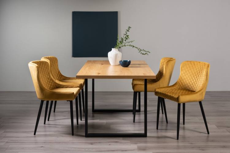 The Bentley Designs  Ramsay Rustic Oak Effect Melamine 6 Seater Dining Table with U Leg & 4 Cezanne Mustard Velvet Fabric Chairs with Sand Black Powder Coated Legs