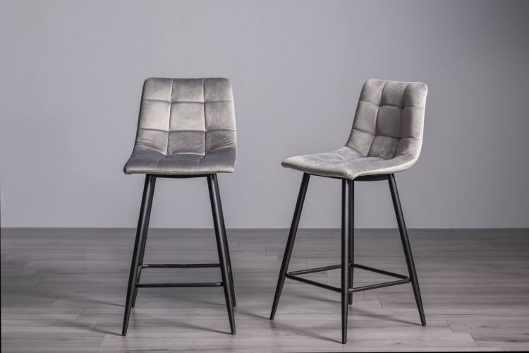 The Bentley Designs Mondrian Grey Velvet Fabric Bar Stools with Sand Black Powder Coated Legs (Pair)