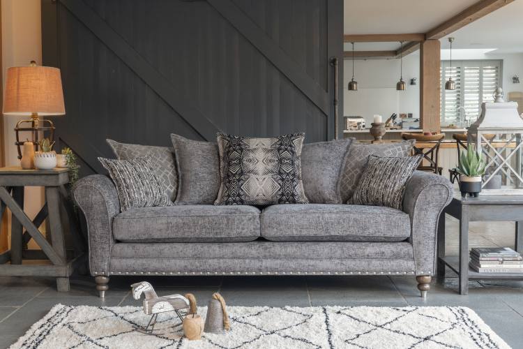 Pictured in fabric 2917 (Band B), 2 pillows in 2137, 2 pillows in 2917, 1 pillow in 2367, small scatter cushions in 2277, antique ash / brushed nickel legs. Item shown with optional pewter studding.