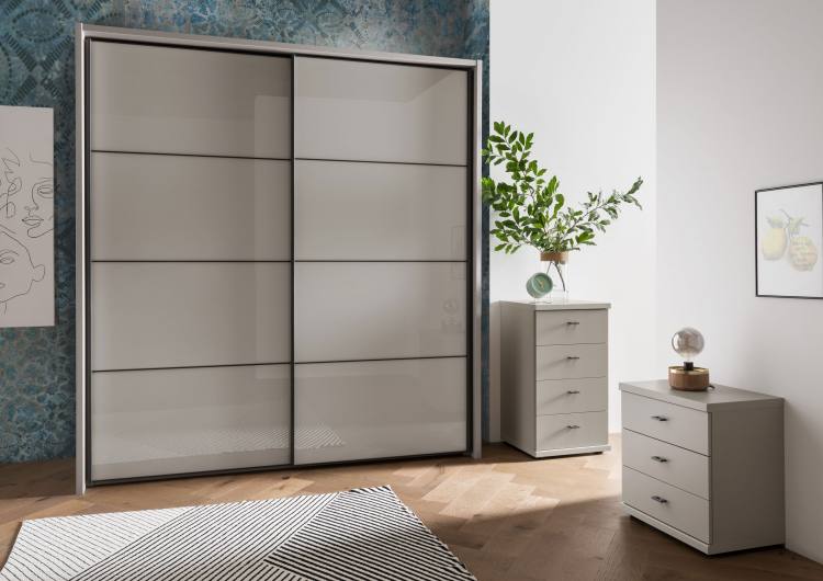 Pictured in Pebble Grey carcase with Pebble Grey Glass doors. 4 panels designs doors with Slate handles and trim. Optional passe-partout frame sold separately.
