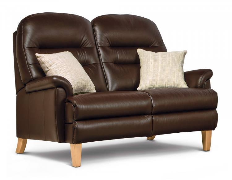 Pictured in Queensbury Chocolate with Light wooden legs, shown with optional extras scatter cushions