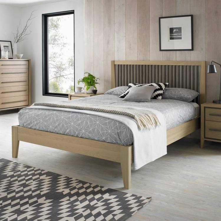 Bentley Designs Rimini Aged Oak & Weathered Oak 2 Drawer Nightstand on Display with Bed